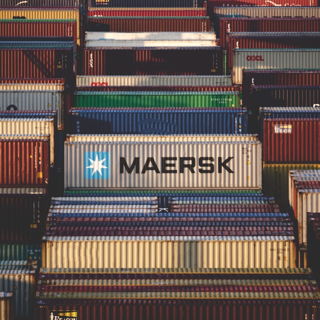 pexels-photo-15876599-15876599 A vibrant collection of cargo containers stacked at a bustling shipping port.
